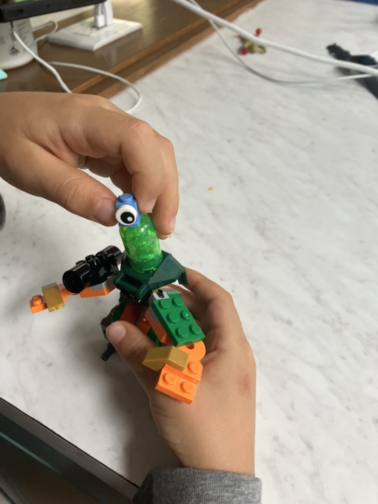 Zane holding his own LEGO creation